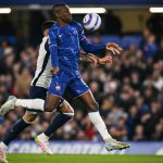 Nicolas Jackson battles for possession against Cristian Romero in a Premier League clash